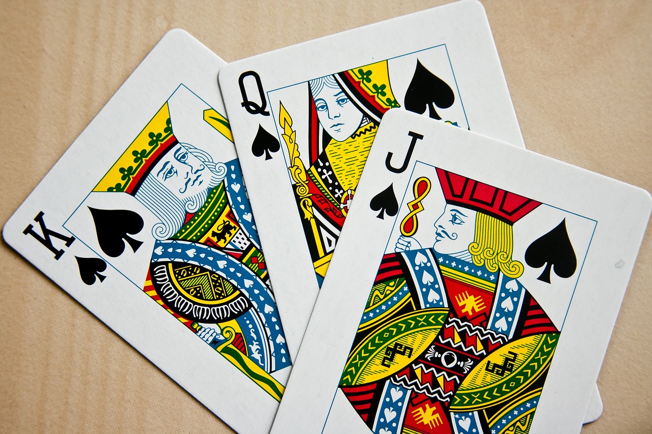 Playing cards face-up — ace king queen of the deck