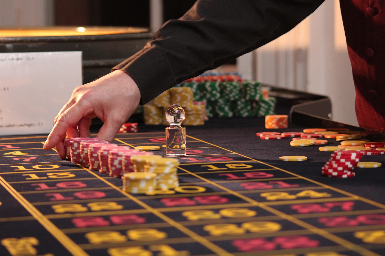 Casino chips on roulette betting table — every system meets the same 2.70% math